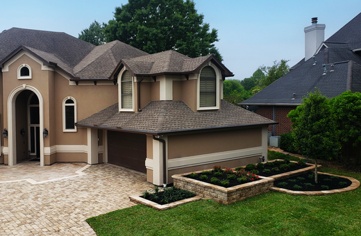 Belgard Paver and Travertine Driveway Front Landscape with Belgard 9D Wall (2.2).png