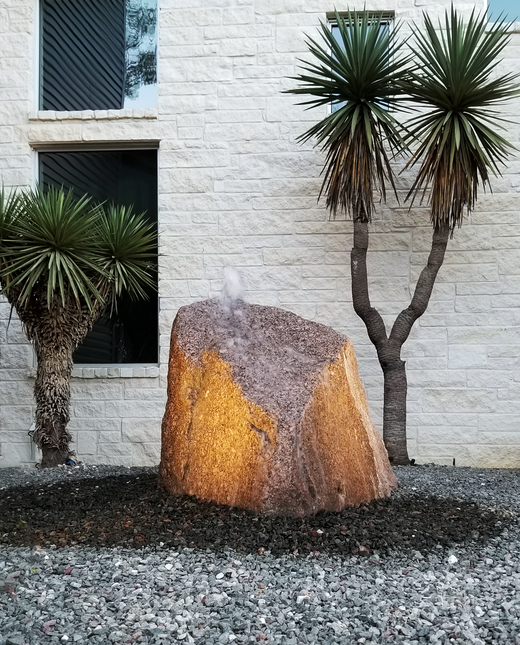 BubblingRock against white wall.png