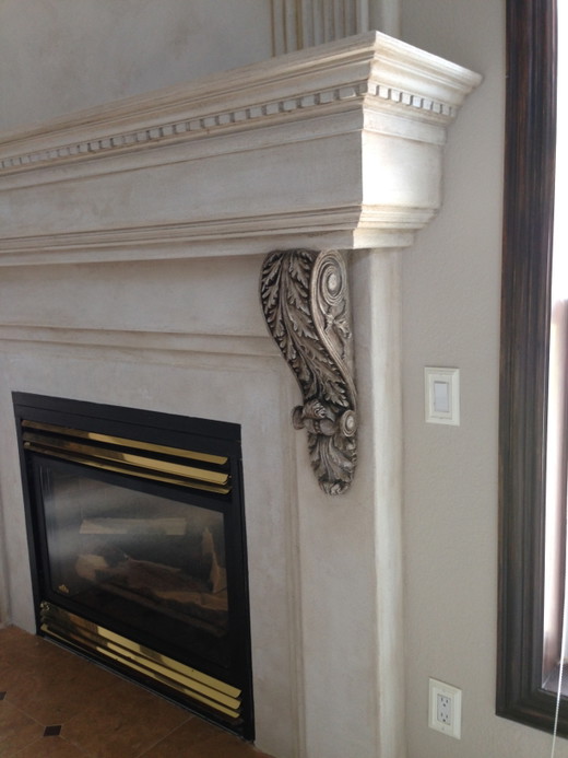 Cream plaster fireplace with antiqued korbels.jpg