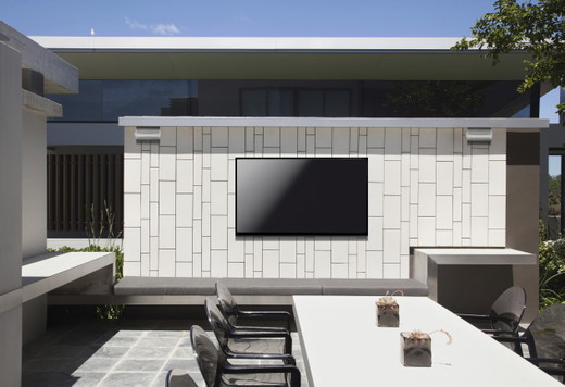 Definitive Technology All Weather 6500 5500 Lifestyle.jpg