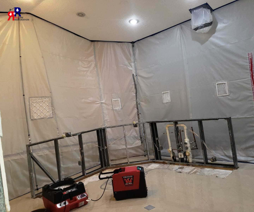 Fort Myers home prepared for water damage restoration with exposed walls and protective coverings.png