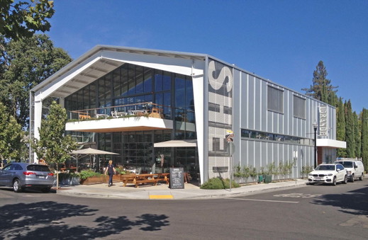 Healdsburg-shed-food-foodie-market-hall-grange-exterior-prefabricated-steel-butler-rigid-frame-insulated-metal-panel-restaurant-cafe-wine-bar-cantilevered-deck-outdoor-seating-exterior.jpg