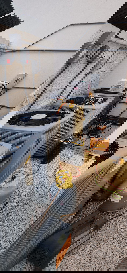 Multiple AC units being serviced and recharged..jpg