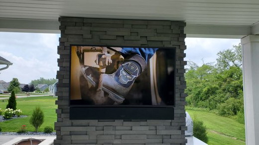 Outdoor TV above fireplace.jpg