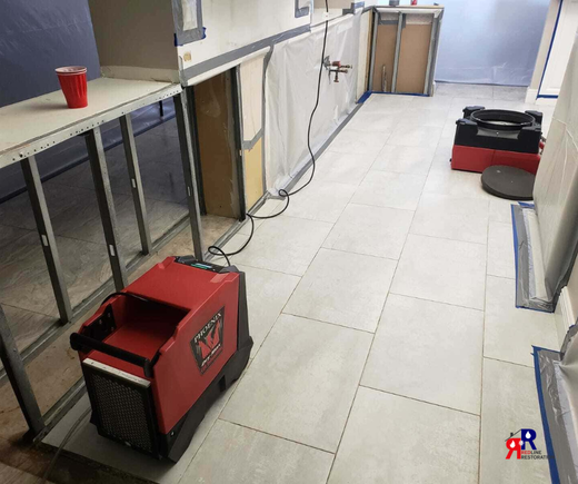 Professional water damage restoration equipment used in Fort Myers for structural drying and moisture control.png