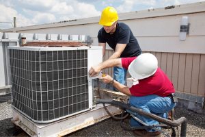 Technicians-working-on-ac-unit-on-roof-300x200.jpg