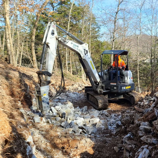 backhoe-clearing-rock-1024x1024.jpg