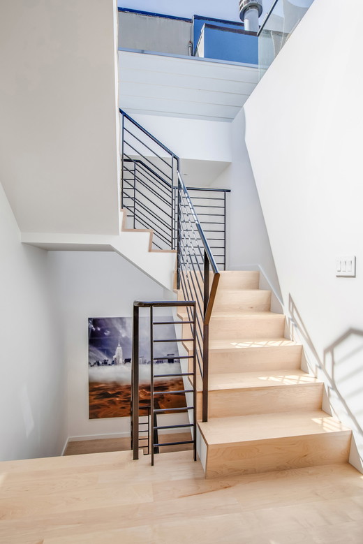 hayes-valley-san-francisco-remodel-modern-minimalist-sustainable-healthy-maple-stair-custom-steel-rod-guardrail-black-2.jpg