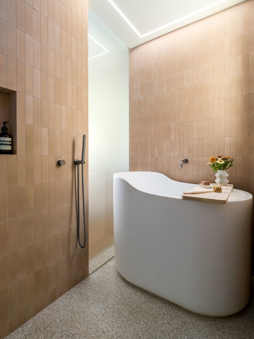 liberty-street-san-francisco-modern-minimalist-remodel-shower-japanese-soaking-tub-pink-cement-tile-standing-shower-terazzo-tile-floor-to-ceiling-translucent-glass.jpg