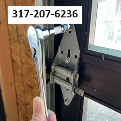 removing-garage-door-hinge.png