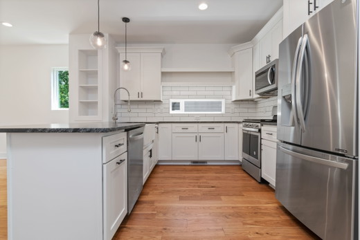 virginia-beach-kitchen-remodel-white-cabinets-black-granite-peninsula.jpg